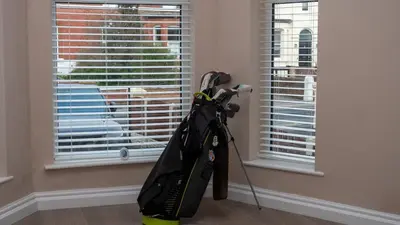 a backpack is standing next to a window at Links Apartment, Southport, Englands Golf Coast in Southport