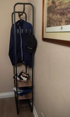 a towel rack in a room with shoes on it at Links Apartment, Southport, Englands Golf Coast in Southport