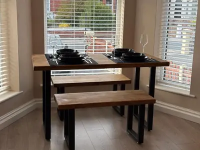 a table with pots and pans on it with a window at Links Apartment, Southport, Englands Golf Coast in Southport