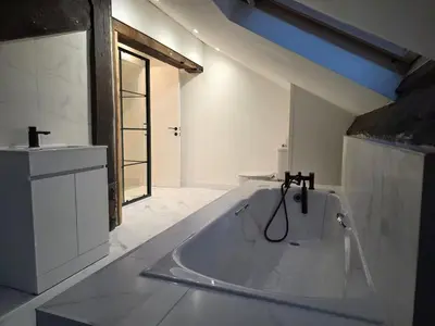 a white bathroom with a tub and a sink at Liverpool Penthouse - Sleeps 8 - City Centre in Liverpool