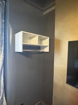 a white cabinet hanging on a wall in a room at Reads Avenue - Luxury Ground Floor Studio - Next Door to H&A Social Club in Blackpool