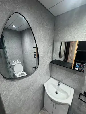 a bathroom with a sink and a mirror at Reads Avenue - Luxury Ground Floor Studio - Next Door to H&A Social Club in Blackpool