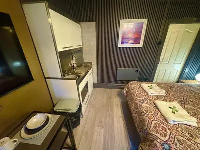 a small room with a bed and a sink at Reads Avenue - Luxury Ground Floor Studio - Next Door to H&A Social Club in Blackpool