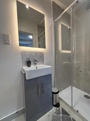 a bathroom with a sink and a shower at Bedford Guesthouse in Liverpool