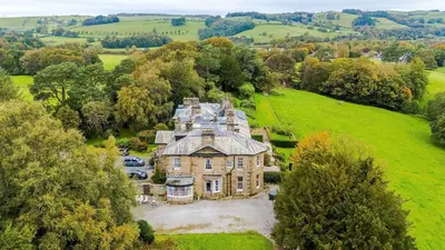 an aerial view of a large house in a field at Escowbeck House - Staycation - HotTub - Sleeps 8 in Lancaster