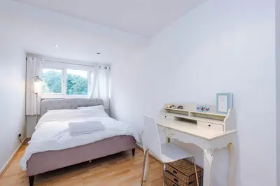 a white bedroom with a bed and a desk at Escowbeck House - Staycation - HotTub - Sleeps 8 in Lancaster