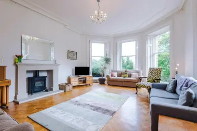a living room with a couch and a fireplace at Escowbeck House - Staycation - HotTub - Sleeps 8 in Lancaster