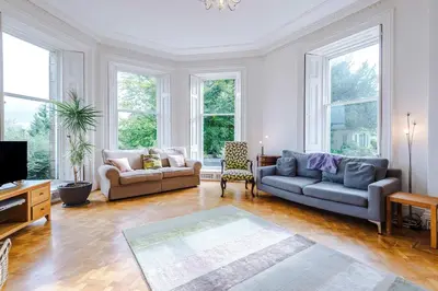 a living room with two couches and a tv at Escowbeck House - Staycation - HotTub - Sleeps 8 in Lancaster