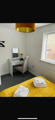 a room with a bed and a desk and a desk at Lancaster Retreat in Lancaster