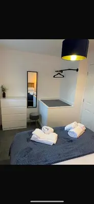 a bedroom with a bed with towels on it at Lancaster Retreat in Lancaster