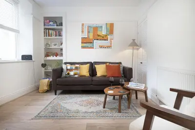 a living room with a couch and a table at Three Bridges - 1-Mile from Ulverston Town Centre in Ulverston