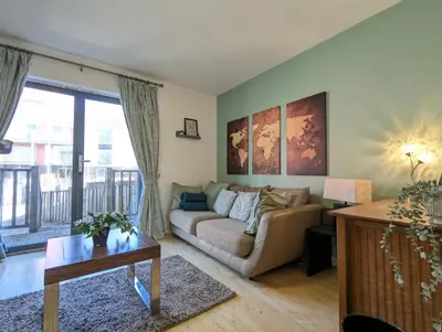 a living room with a couch and a table at Large 3-Bedrooms House Near Centre Free Parking in Liverpool