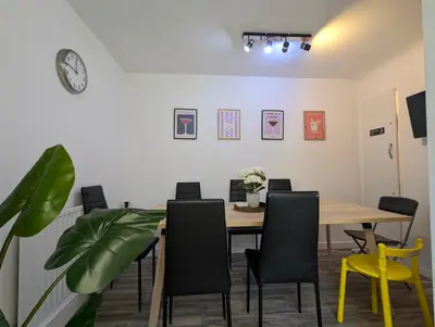 a dining room with a wooden table and chairs at Large 3-Bedrooms House Near Centre Free Parking in Liverpool