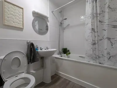 a bathroom with a toilet and a sink and a shower at Large 3-Bedrooms House Near Centre Free Parking in Liverpool