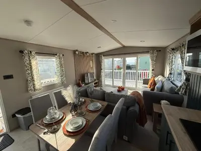 a living room with a couch and a table at The Retreat LD 1A Oceans Edge in Morecambe