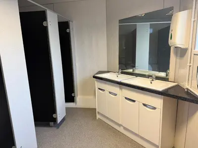 a bathroom with two sinks and a mirror at Art Group Apartments in Fleetwood