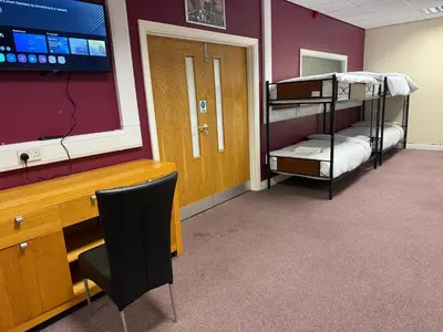 a room with two bunk beds and a desk at Art Group Apartments in Fleetwood