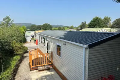 a tiny house with a porch and a roof at 2 Bed Caravan-Sleeps 6-Pet Friendly in Carnforth