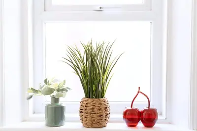 a window sill with two vases and a plant at The Lytham Retreat - New! Spacious & Luxurious in Lytham St Annes