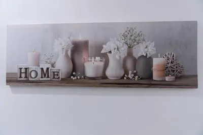 a shelf with vases and candles and flowers on it at The Lytham Retreat - New! Spacious & Luxurious in Lytham St Annes