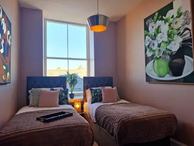 a room with two beds and a window at Hamilton - The Hyde Luxury Let in Preston