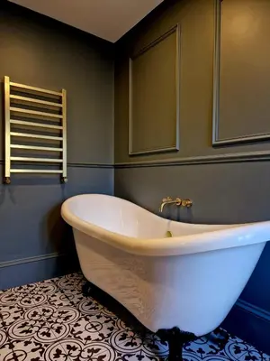 a large white tub in a bathroom with a tile floor at Hamilton - The Hyde Luxury Let in Preston
