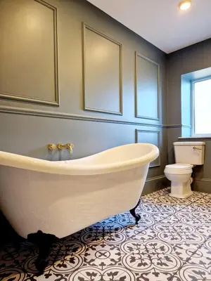 a bathroom with a white tub and a toilet at Hamilton - The Hyde Luxury Let in Preston