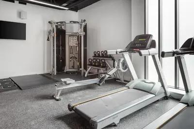 a gym with two treadmills and a treadmill at The Ascent in Liverpool