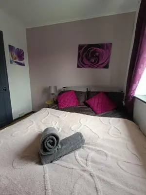 a bed with a towel laying on top of it at #72 Stylish 3 bedroom sleeps 7 Wigan House in Pemberton