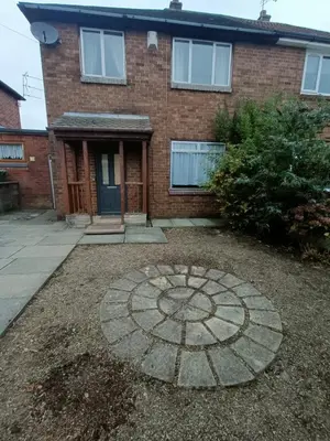 a brick house with a stone circle in front of it at #72 Stylish 3 bedroom sleeps 7 Wigan House in Pemberton
