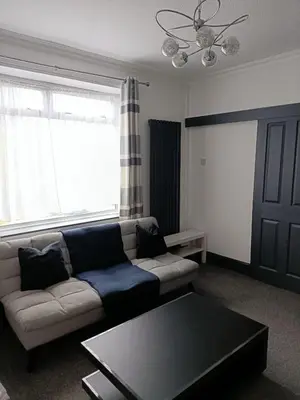 a living room with a couch and a coffee table at #72 Stylish 3 bedroom sleeps 7 Wigan House in Pemberton