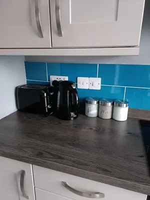 a kitchen counter top with a coffee maker on it at #72 Stylish 3 bedroom sleeps 7 Wigan House in Pemberton