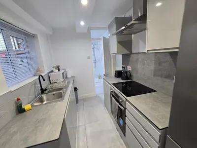 a kitchen with a sink and a counter top at House 5 Minutes from Sefton Park in Liverpool
