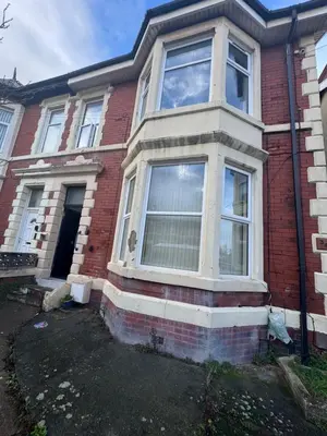 a red brick house with a large window at Snug Studio - Minutes Walking from Pleasure Beach - Burlington Road in Blackpool