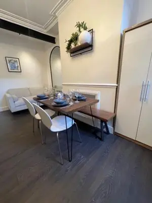 a dining room with a table and chairs and a room at Liverpool Jasmine House - Spacious 2-Bed Near Anfield Stadium in Liverpool