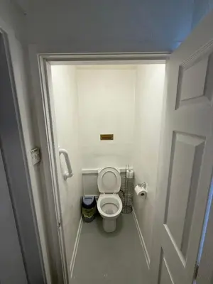a small bathroom with a toilet in a stall at Jubilee holiday flats in Blackpool