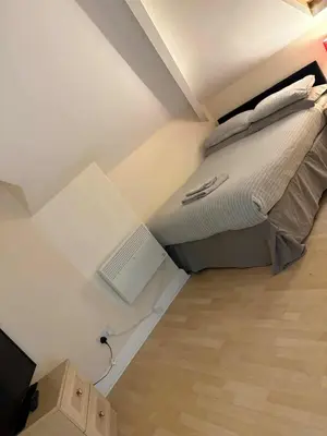 a small bedroom with a bed in the ceiling at MARLEY MANSIONS APARTMENT Clarendon FT3 in Wallasey