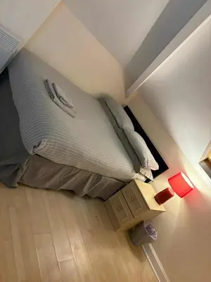 a large bed in a small room with at MARLEY MANSIONS APARTMENT Clarendon FT3 in Wallasey