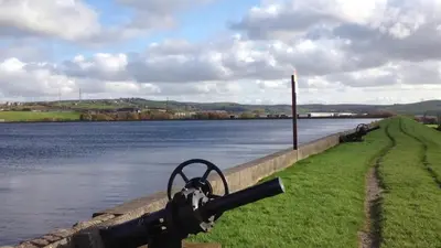 a cannon on the side of a body of water at The Nightingale in Lower Darwen