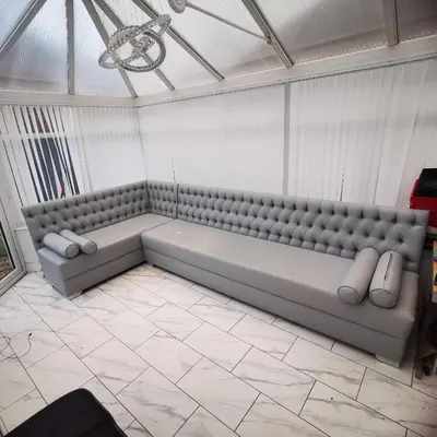 a room with a large bench in a room at The Nightingale in Lower Darwen