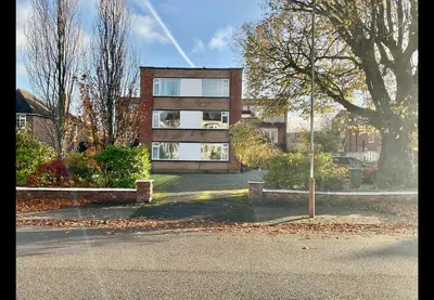 a large brick house in the middle of a street at Southport-Birkdale Luxury Haven in Southport