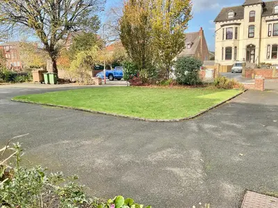 a grassy area in the middle of a street at Southport-Birkdale Luxury Haven in Southport