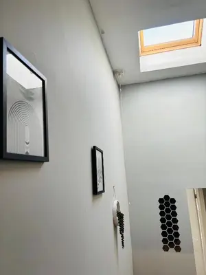 a bathroom with a mirror and a window on the wall at Wallasey Nest in Wallasey