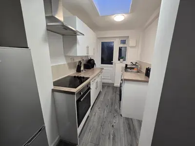a kitchen with a sink and a stove top oven at Room 1 Shared House 3 min from Stadium in Liverpool
