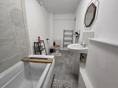 a white bathroom with a sink and a toilet at Room 2 Shared House 3 min from Stadium in Liverpool