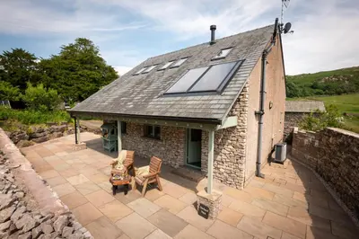 an image of a house with a solar roof at Ellenboro House, Cosy Sleeps 2, Near Cartmel in Grange Over Sands
