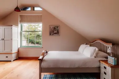 a bedroom with a bed and a window at Ellenboro House, Cosy Sleeps 2, Near Cartmel in Grange Over Sands