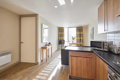 a kitchen with a counter top and a microwave at Host & Stay - Hatton Garden Apartments in Liverpool