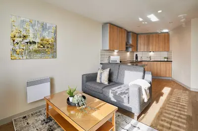 a living room with a couch and a table at Host & Stay - Hatton Garden Apartments in Liverpool
