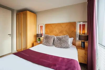 a bedroom with a large white bed and two lamps at Host & Stay - Hatton Garden Apartments in Liverpool